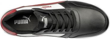 The shoe is predominantly black with white and red accents. It has a flat sole, laces, and the Puma logo on the top. It looks sporty and modern.