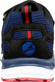 The image shows the back part of a sports shoe. The shoe is primarily black with blue and red accents. A round, blue graphic is visible on the side. The sole is white with red details.