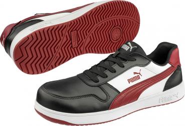 The image shows a pair of athletic shoes. They are predominantly black with red and white accents, have a flat sole, and laces. The Puma logo is visible.