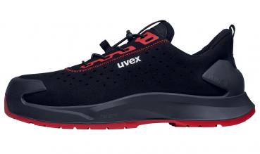 The shoe is a sporty, black sneaker with red accents. It features a low silhouette, a grippy sole, and a padded heel for comfort. The brand name "uvex" is displayed on the side.