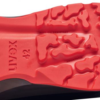 The image displays the sole of a shoe with a deep, red rubber surface. It features a textured tread with waves and indentations. The brand "Uvex" and the size "42" are clearly embossed.