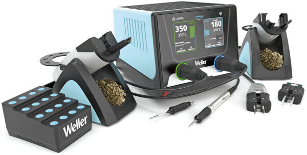 The image shows a soldering station with two soldering units, a digital display, two soldering tips, a cleaning brush, and cables. Everything is in black and blue.