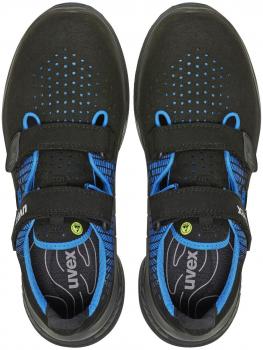 The image shows a pair of black shoes with blue accents. They have a sporty design, with two wide Velcro straps and a perforated surface for ventilation.