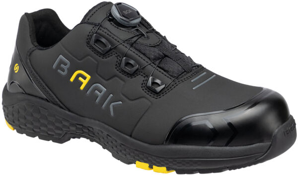 The shoe is black with yellow accents. It has a reinforced toe, a closed lacing system, and a non-slip sole. The surface is smooth, and the design is sporty.