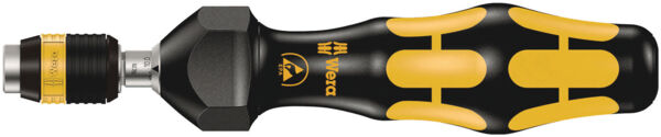 The image shows a screwdriver with an ergonomically shaped, black grip surface and yellow rubber elements. The screwdriver has a hexagonal head and a sturdy, metal tip.