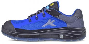 The shoe is sporty, primarily in blue with black and grey elements. It features a sturdy rubber sole and a reinforced toe. The laces are grey and the tongue is lightly padded.