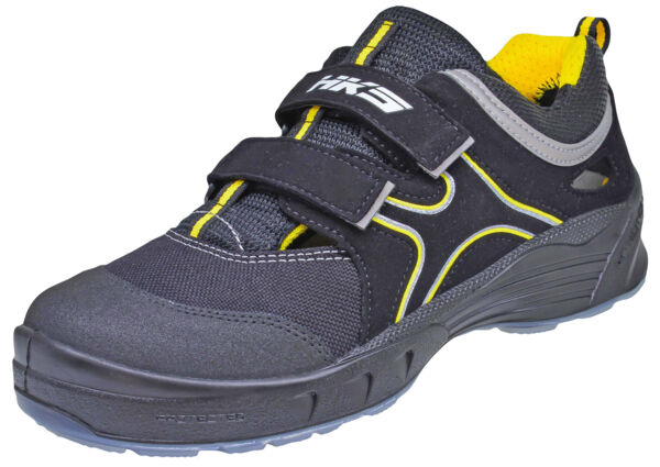 The shoe is in black with yellow accents. It has a round toe, a breathable upper, and two convenient Velcro closures for easy on and off.