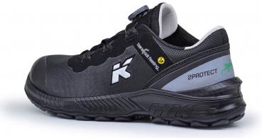 The shoe is sporty and black with gray and white accents. It features a padded sole and is designed for protection and comfort, ideal for active use.