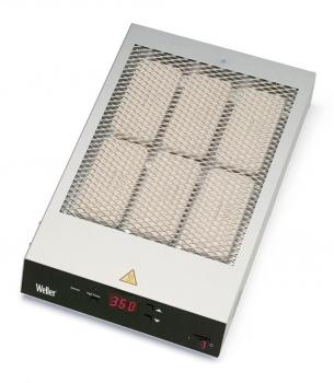 The image displays a square heating device with a metal grid on top and a digital display. It features a triangular warning sign and controls at the bottom.