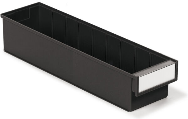 The image shows a long, narrow container made of black plastic with an open top and a smooth, white label area on the front. It has interior compartments for division.