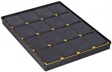 The image displays a rectangular, flat object with a black surface. It features 16 evenly arranged, square indentations separated by yellow lines.