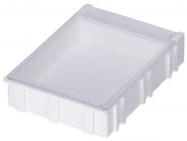 The image shows a flat, rectangular, and transparent plastic box with a closed lid. The walls are textured, and the box has a practical shape for storage.