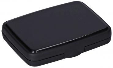 The image shows a rectangular, flat box in matte black. It has rounded edges and a simple, inconspicuous lid that is easy to open.