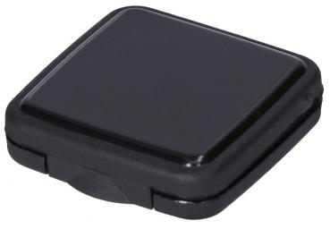 The image displays a flat, square, black object with rounded corners. The surface is slightly glossy, and there is a small notch on one side, presumably an opening or tab.