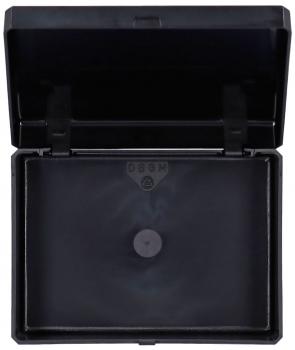 The image shows a black, rectangular box with a foldable lid that is open. Inside, the box is also black and has a small round button in the center.