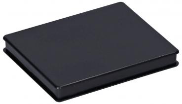 The image shows a rectangular, black object with a flat surface. It has rounded edges and looks like a small, closed case or box.