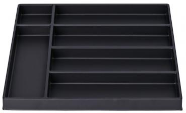 The image shows a black plastic cutlery tray with multiple compartments. On the left side, there is a narrower compartment, and on the right, there are several larger rectangular compartments.