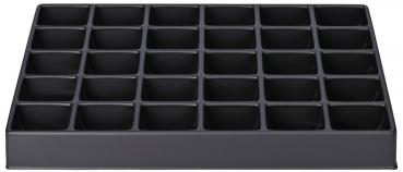 The image displays a rectangular, black storage tray with 36 smaller compartments. It has a flat shape and is used for organizing items. The compartments are evenly arranged.