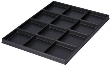 The image displays a flat, rectangular tray in black, divided into twelve equal compartments. It has a raised edge that encircles the compartments.