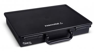 The image shows a black, rectangular storage box with a flat lid. It has a practical grip groove and two hinges on the front side. The "raaco" logo is printed on it.