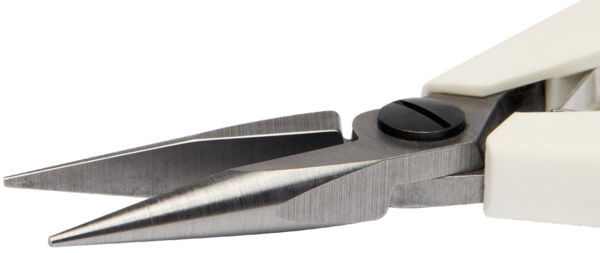 The image shows a pair of scissors with sharp, metallic blades and a white handle. The two blades are close together, with a black screw securing the connection.