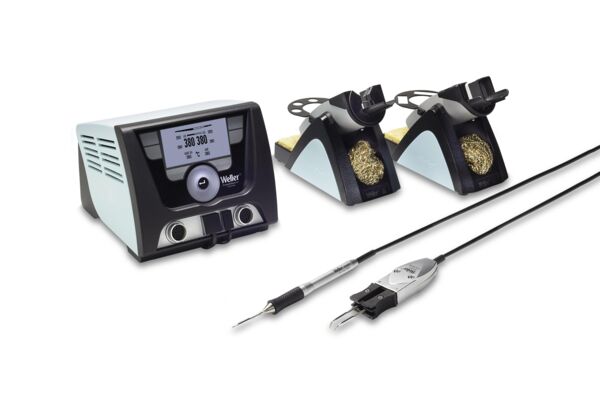 The image shows a soldering station set with a control box, two holders for soldering irons, a soldering iron, and a tool with a switch. The control box has a digital display.