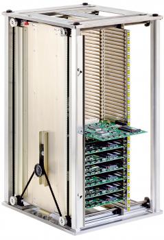 The image shows a vertical metal device with transparent sides. Inside, there are several green circuit boards, stacked and held by a structure.