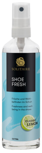 In the picture, there is a transparent spray bottle with a blue label. It says "Shoe Fresh" in large letters. The label is adorned with a yellow lemon symbol.