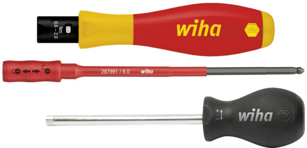 The image shows three screwdrivers. At the top, a yellow-red screwdriver with a wide blade. In the middle, a red screwdriver with a special tip. At the bottom, a black screwdriver with a simple blade.