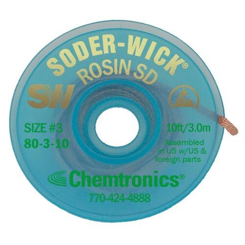 The image shows a round, transparent blue spool with an inner hole. It reads "SODER-WICK" along with other technical details. It is used for desoldering in electronics.