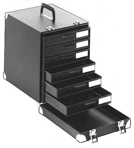 The image shows a black, rectangular box with a handle on top. It has several drawers that can be pulled out from the front. Ideal for organizing small items.