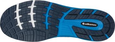 The image shows the sole of a sports shoe. It features a textured, black tread with blue and white accents. The design ensures good traction and durability.