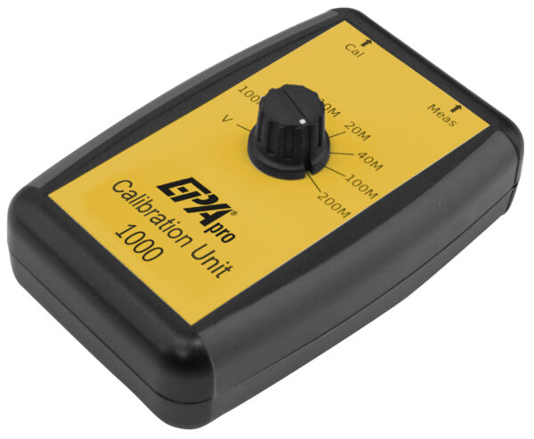 The image shows a black, rectangular device with a yellow front. In the center, there is a rotary knob with scales for various values and labels "Cal" and "Meas".