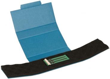 The image shows an open blue cardboard box with a black liner. On the liner, there are four green components that look like small levers. The box is foldable.