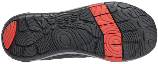 The image shows the sole of a shoe with a non-slip, wavy tread. There are black rubber areas and a striking red area in the middle. The sole is sturdy and provides good grip.