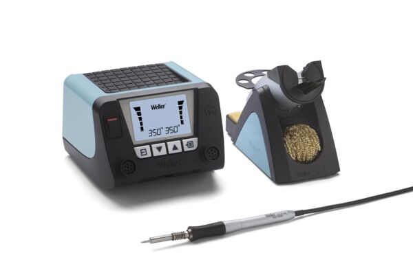 The image displays a soldering device with a digital display and control buttons. Next to the device are a soldering iron holder and a wire cleaning device. Everything has a modern, functional shape.