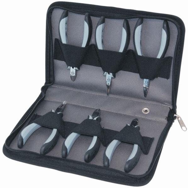 The image shows a black tool bag equipped with six pliers. The pliers have ergonomic handles and are neatly arranged in compartments. They are intended for precise work.