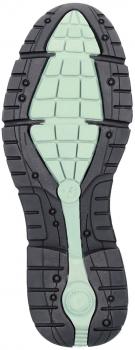 The image displays the underside of a sports shoe. The sole is predominantly black with a light green, grid-like structured central zone. It features several grooves and small knobs for improved grip.