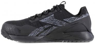 The image shows a black Reebok sports shoe. It features a modern design with a textured surface and gray design elements. The sole is stable and slightly elevated.