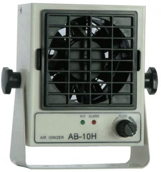 The image shows an air ionizer in a compact, rectangular casing. It has a round fan with a grid and two indicator lights (green and red) as well as a rotary knob for adjusting the airflow.