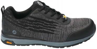 The shoe is a sporty, low-cut sneaker in black and gray. It has a textile upper with a textured pattern and a sturdy rubber sole for good grip.