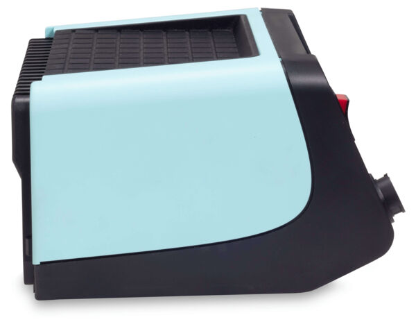 The image displays a compact device in mint green and black. It features a flat side with a grid-like pattern and a rounded shape. A vent is visible on the side.