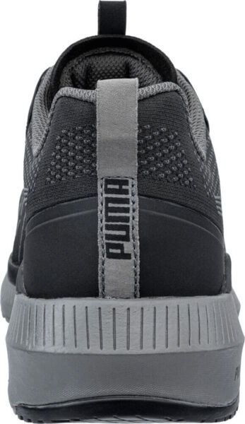 The image shows the rear view of a black athletic shoe with gray details. It features a padded tongue, a textured upper, and a non-slip sole. The brand name "PUMA" is visible.