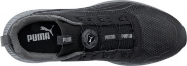 The image shows a black sports shoe with a mesh upper. The laces have been replaced by a convenient twist lock, and the Puma logo is prominently displayed multiple times.