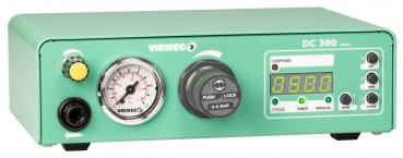 The image shows a mint green device with a digital display, a pressure gauge, and several controls, including buttons and a rotary knob.