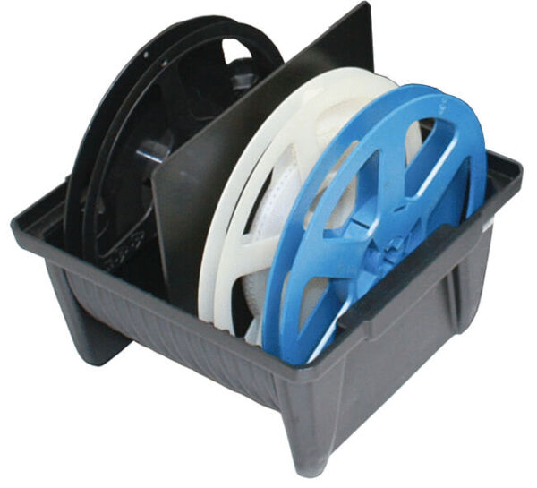 The image shows a gray box with three rollers. One roller is black, one is white, and one is blue. The rollers vary in size and are arranged with the blue one on top.