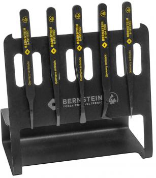 The image shows a black tool holder containing five long, narrow tools with yellow handles. The handles are labeled 