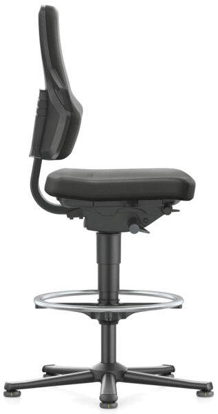 The chair has a high, padded seat and an ergonomic backrest. It is mounted on a stable frame and has a round footrest. The color is black.