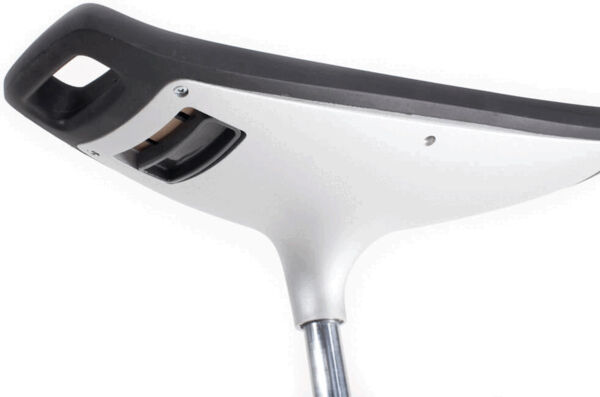 The image shows the underside of a seat. The surface is primarily white, with a black border. There are slots and screws for attachment. The seat has a metal rod.