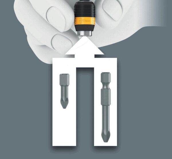 The image shows a hand holding a nozzle with a yellow ring. Below is a white, rectangular shape with two gray bits on the sides that look like tools.